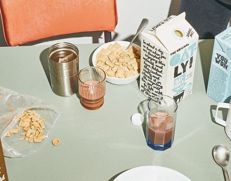 Oatly cartons on a breakfast table